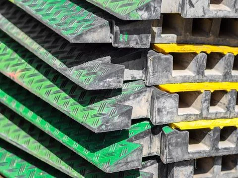 A stack of interlocking green and yellow panels Stock Photos