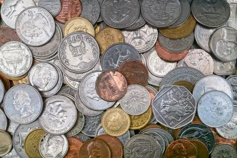Stack of international coins Stock Photos