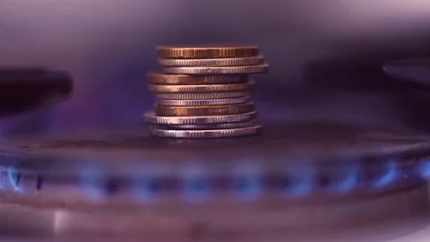 A stack of iron coins on a gas burner close-up. Stock Footage 85263137