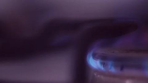 A stack of iron coins on a gas burner close-up. Stock Footage 85263467