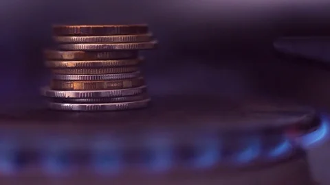A stack of iron coins on a gas burner close-up. Stock Footage 85263683