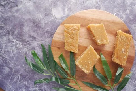 Stack of Jaggery traditional cane sugar cube on table Stock Photos