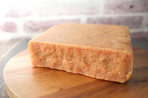 Stack of Jaggery traditional cane sugar cube on table Stock Photos