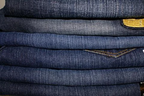 Stack of Jeans Denim Fabric Background Fashion Stock Photos