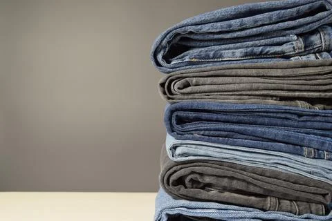 A stack of jeans of different colors Stock Photos