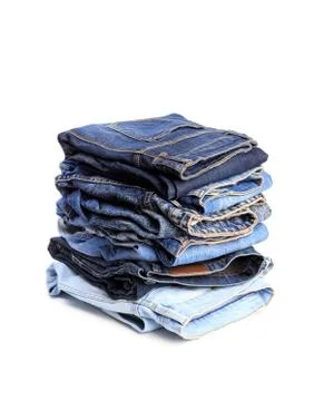 Stack of jeans pants on white background Stock Photos