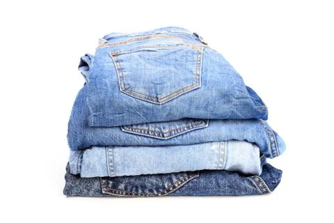 Stack of jeans pants on white background Stock Photos
