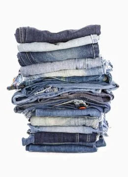 Stack of jeans on white background Stock Photos