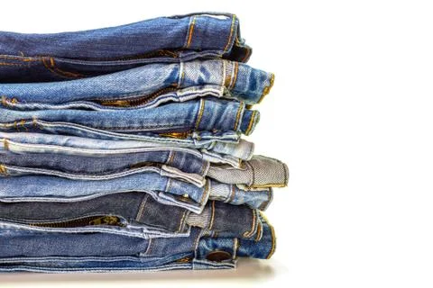 Stack of jeans on white background. Stock Photos