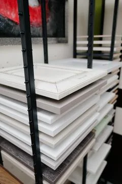 A stack of kitchen cabinet samples in different colors and textures Stock Photos