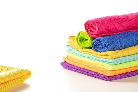 Stack of kitchen microfiber towels in bright colors on a white background Stock Photos