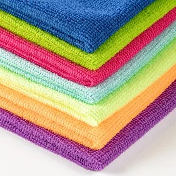Stack of kitchen microfiber towels in bright colors on a white background Stock Photos
