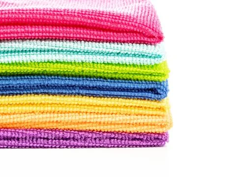 Stack of kitchen microfiber towels in bright colors on a white background Foto stock
