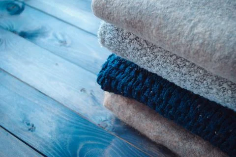 Stack of knitted and woolen winter clothes Stock Photos