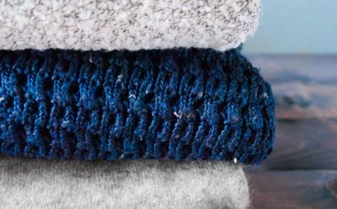 Stack of knitted and woolen winter clothes Stock Photos