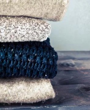Stack of knitted and woolen winter clothes Stock Photos
