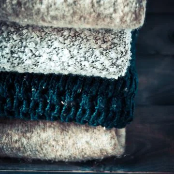 Stack of knitted and woolen winter clothes Stock Photos