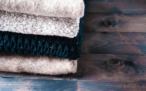 Stack of knitted and woolen winter clothes Stock Photos