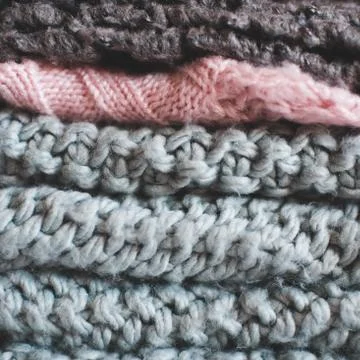 Stack of knitted clothing closeup. Winter season. 스톡 사진
