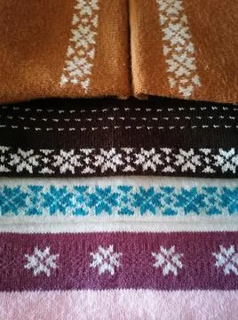 Stack of knitted colour sweaters Stock Photos