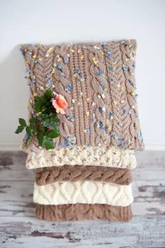 A stack of knitted pillows Stock Photos