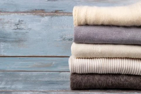 Stack of knitted sweaters Stock Photos