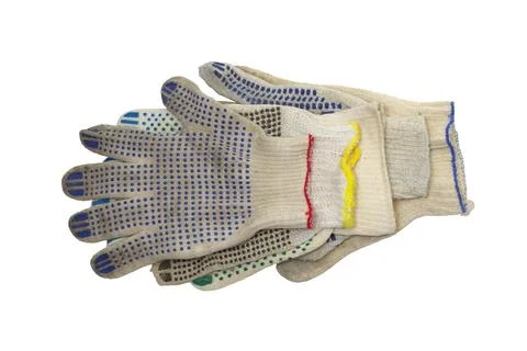 Stack of knitted working gloves with colorful rubber dots, neatly arranged .. Stock Photos