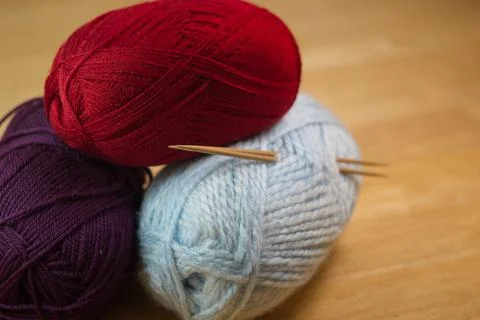 Stack of knitting yarn skeins with needles Stock Photos