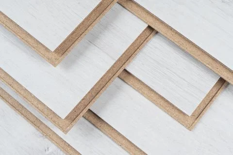 A stack of laminate flooring. Laminate flooring panels background texture. .. Stock Photos