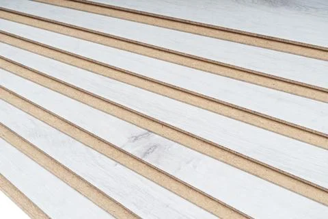 A stack of laminate flooring. Laminate flooring panels background texture. .. Stock Photos