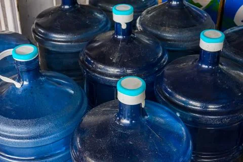 Stack of Large Blue Plastic Water Gallons Stock Photos