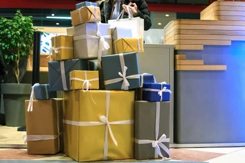 Stack of large gift boxes in wrapping paper, christmas holidays decor Foto stock