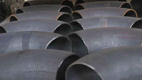 Stack of large metal pipes in storage Stock Footage 277110261
