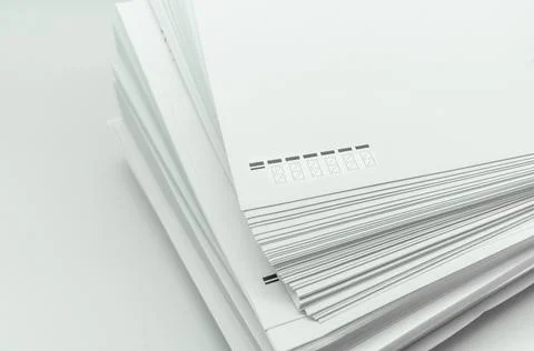 A stack of large white postal envelopes. Packaging for letters and documents Stock Photos