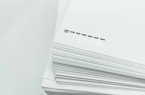 A stack of large white postal envelopes. Packaging for letters and documents Stock Photos