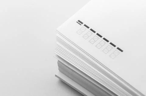 A stack of large white postal envelopes. Packaging for letters and documents Stock Photos