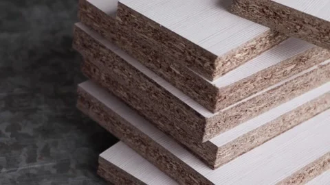 Stack of laser cut white melamine boards Stock Footage 149333629