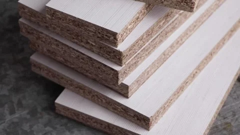 Stack of laser cut white melamine boards Stock Footage 150917763