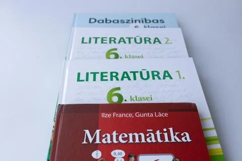 Stack of Latvian school textbooks for mathematics, literature. Stock Photos