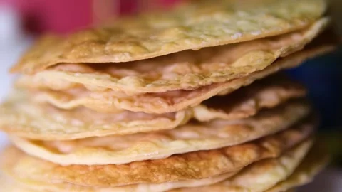 A stack of layers cakes for caramel cake on cooling rack. stack of cake layers Stock Footage 295036051