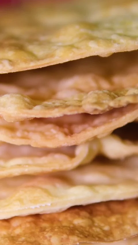 A stack of layers cakes for caramel cake on cooling rack. stack of cake layers Stock Footage 295234058