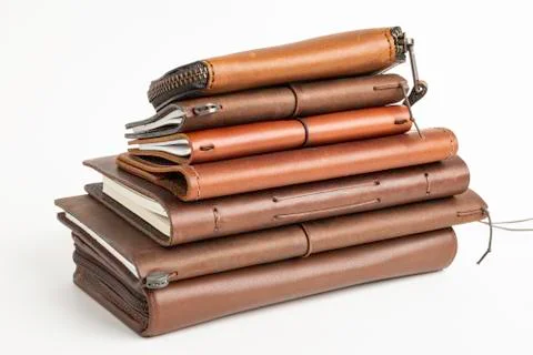 A Stack Of Leather-Bound Journals, Notebooks, Wallets &amp; Cases Stock-Fotos