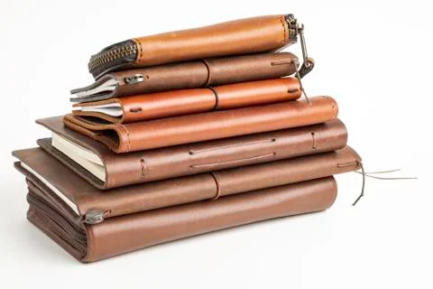 A Stack Of Leather-Bound Journals, Notebooks, Wallets &amp; Cases Stock Photos