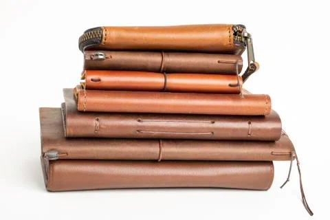 A Stack Of Leather-Bound Journals, Notebooks, Wallets &amp; Cases Stock Photos