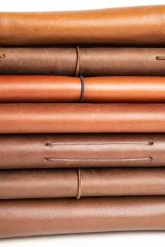 A Stack Of Leather-Bound Journals, Notebooks, Wallets &amp; Cases Stock Photos