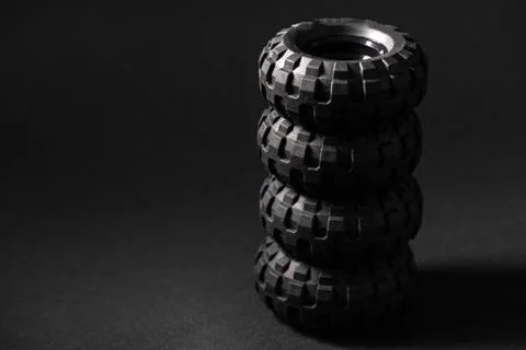 Stack of lego tires close up over black background Stock Photos