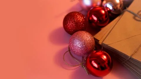 Stack of letters from craft paper with christmas red and pink balls 스톡 사진