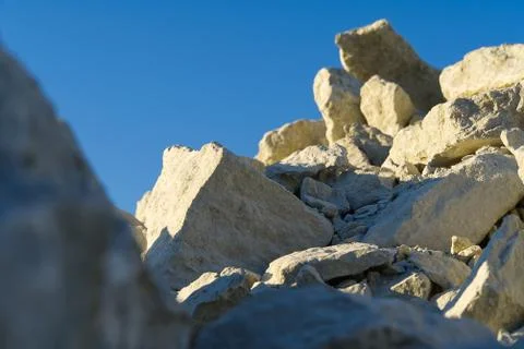 Stack of limestone. big crushed limestone stone. broken sandstone close-up Stock Photos