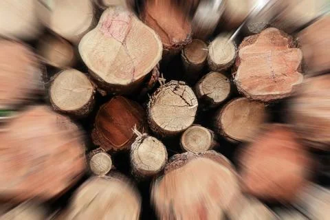 Stack logs closeup speed movement speed blurred brown wooden background Stock Photos