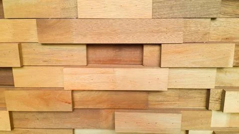Stack of lumber.Textured of wooden cube background, wooden backdrop. Stock Photos